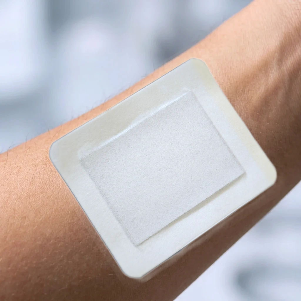 A close-up of the Yakou transdermal patch on skin